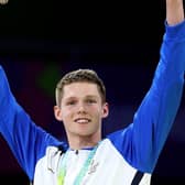 Duncan Scott celebrates with his 200m individual medlay gold medal at Birmingham 2022. (Photo by Mark Kolbe/Getty Images)