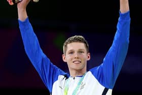 Duncan Scott celebrates with his 200m individual medlay gold medal at Birmingham 2022. (Photo by Mark Kolbe/Getty Images)