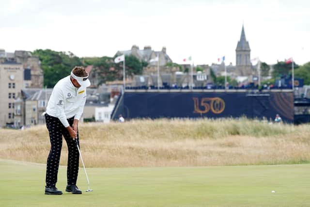 England's Ian Poulter putts on the 16th green during day one of The Open at the Old Course, St Andrews.