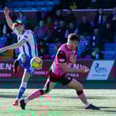 Kilmarnocks' Ash Taylor scores to make it 1-0 during the cinch Championship match between Kilmarnock and Queen of the South at Rugby Park.