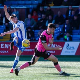 Kilmarnocks' Ash Taylor scores to make it 1-0 during the cinch Championship match between Kilmarnock and Queen of the South at Rugby Park.