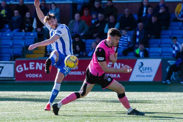 Kilmarnocks' Ash Taylor scores to make it 1-0 during the cinch Championship match between Kilmarnock and Queen of the South at Rugby Park.