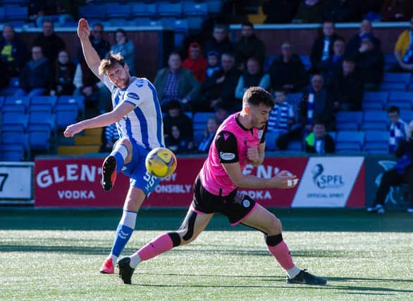 Kilmarnocks' Ash Taylor scores to make it 1-0 during the cinch Championship match between Kilmarnock and Queen of the South at Rugby Park.