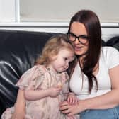 Mum Lisa Crawford and dad,Jordan Tripney with two-year-old Arya who has been diagnosed with a very rare, inoperable and incurable brain tumour. Pic Micheal Gillen