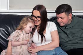 Mum Lisa Crawford and dad,Jordan Tripney with two-year-old Arya who has been diagnosed with a very rare, inoperable and incurable brain tumour. Pic Micheal Gillen