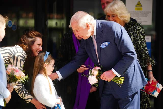 King Charles is presented with a bouquet as he leaves following a visit to University College Hospital Macmillan Cancer Centre, London. Picture: PA