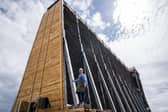 Master Salter and founder of Blackthorn Salt Gregorie Marshall alongside the new salt graduation tower on the coast at Ayr.