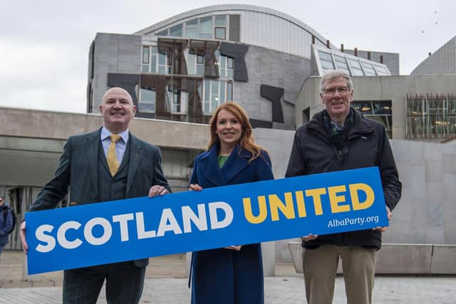 Ash Regan MSP poses next to Neale Hanvey MP and Kenny MacAskill MP after defecting from the SNP and joining the Alba Party. Image: Lisa Ferguson/National World.