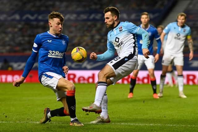Nathan Patterson and Tony Andreu in action during a Scottish Premiership match between Rangers and Ross County at Ibrox, on January 23, 2021, in Glasgow, Scotland. (Photo by Rob Casey / SNS Group)