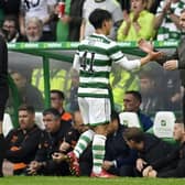 Celtic manager Ange Postecoglou (R) with Reo Hatate - the Japanese midfielder is expected to miss this weekend's match against Kilmarnock.