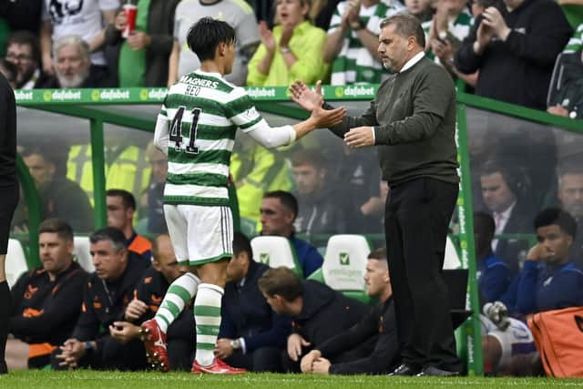 Celtic manager Ange Postecoglou (R) with Reo Hatate - the Japanese midfielder is expected to miss this weekend's match against Kilmarnock.