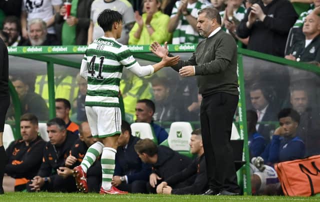 Celtic manager Ange Postecoglou (R) with Reo Hatate - the Japanese midfielder is expected to miss this weekend's match against Kilmarnock.