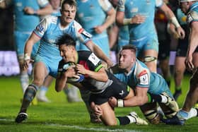 Harlequins' Marcus Smith (centre) scores their second try during the narrow win over Glasgow Warriors.