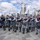 Members of the Camelon & District, Wallacestone & District and Falkirk Schools pipe bands play during a special event day to celebrate the 10th anniversary of the Kelpies