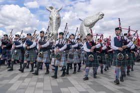 Members of the Camelon & District, Wallacestone & District and Falkirk Schools pipe bands play during a special event day to celebrate the 10th anniversary of the Kelpies