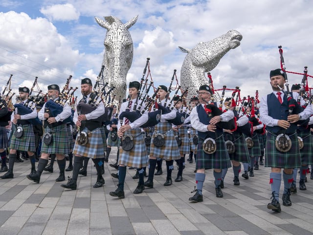 Members of the Camelon & District, Wallacestone & District and Falkirk Schools pipe bands play during a special event day to celebrate the 10th anniversary of the Kelpies