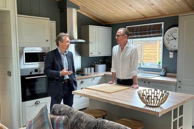 John Lamont MP is shown the light and spacious interior of one of the woodland lodges
