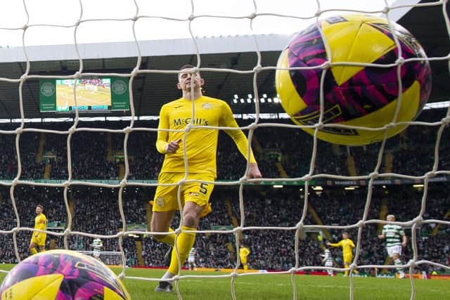 Morton's Jack Baird looks on despairingly as Celtic's Kyogo Furuhashi makes it 2-0. (Photo by Ross MacDonald / SNS Group)