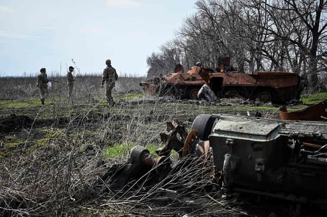 Ukrainian servicemen inspect remains of destroyed armored vehicles at former position of Russian troops in the north of Kharkiv region on April 11, 2023. 

Claims that UK special forces have operated in Ukraine have been widely reported after allegedly leaked documents were published online.