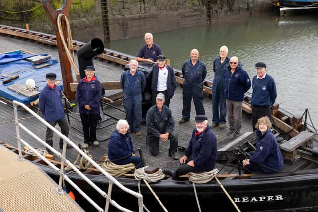Scottish Fisheries Museum’s iconic ‘Fifie’ the Reaper.
Scottish Fisheries Boat Club.
Top to bottom, left to right: The Reaper Skipper Mike Barton, Nick Chalmers, Tony Davis, Winston Stewart, Coull Deas MBE, Bob Flan, Donald McDonald, Dave Crowther, Rodger McAslan, Andrew Gould, Sadie Crowther, Jim Wilson, Lesley McConnell
Volunteers at the Scottish Fisheries Museum’s Boat Club, which help maintain and sail Reaper, have so far contributed over 700 hours to the final phase of the £1million conservation, working on the internal refit, reinstating the cabins, galley, display areas and navigational aids.
Photograph by Martin Shields