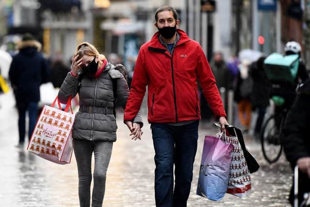 Shoppers wearing face masks in Glasgow (Photo by Jeff J Mitchell/Getty Images).
