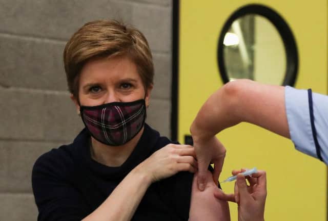 Nicola Sturgeon sets an example by getting her Covid booster, but should she be doing more? (Picture: Russell Cheyne/Pool/AFP via Getty Images)