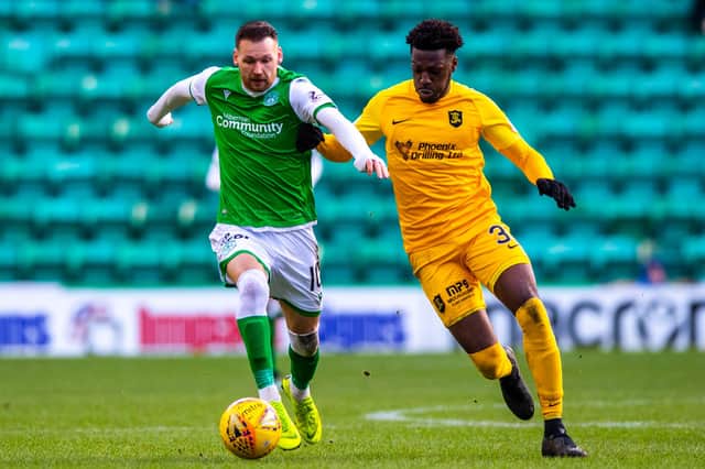 Martin Boyle and Steve Lawson in action during the Ladbrokes Premiership match between Hibernian and Livingston at Easter Road on February 22, 2020.  (Photo by Alan Harvey / SNS Group)