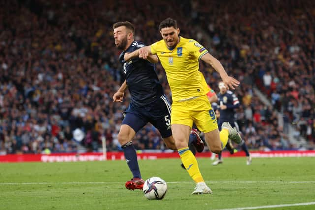 Scotland defender Grant Hanley tussles for possession with Ukraine striker Roman Yaremchuk during the World Cup play-off semi-final at Hampden. (Photo by Ian MacNicol/Getty Images)