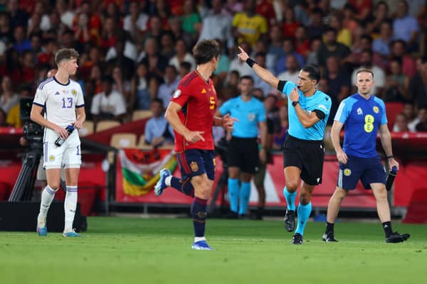 Referee Serdar Gozubuyuk disallows the goal scored by Scotland's Scott McTominay against Spain. (Photo by Fran Santiago/Getty Images)