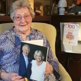 Ruth Park-Pearson holding one of the first 100-year-old birthday cards