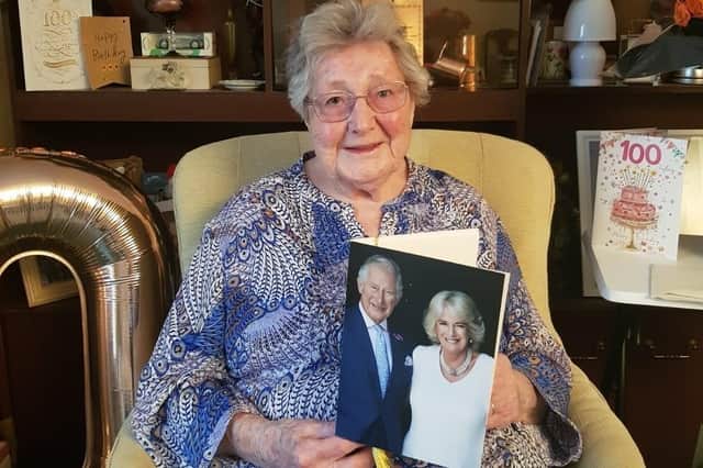 Ruth Park-Pearson holding one of the first 100-year-old birthday cards