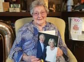 Ruth Park-Pearson holding one of the first 100-year-old birthday cards
