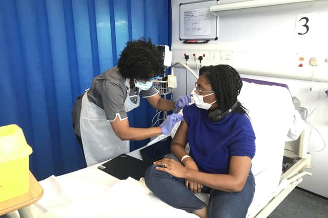 UK Government Minister for Equalities, Kemi Badenoch, receiving her first vaccination as part of the Novavax phase 3 trial, which she is taking part in at Guy's and St. Thomas' NHS Foundation Trust, London. Two MPs from the Labour and Conservative parties volunteered for vaccine trials, following a call for more ethnic minority volunteers.