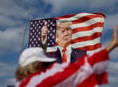 A flag featuring former President Donald Trump that supporters are flying near his Mar-a-Lago home (Photo by Joe Raedle/Getty Images)
