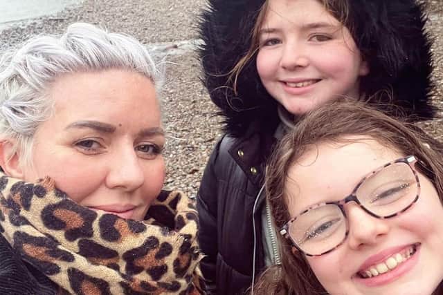 Adele Hughes with her daughters Siena and Elise.