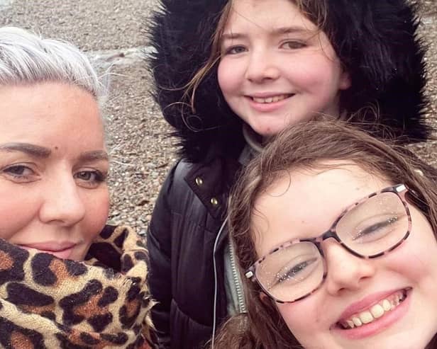 Adele Hughes with her daughters Siena and Elise.