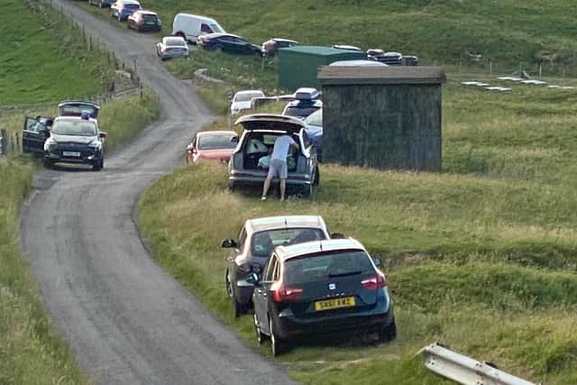 Cars parked by the roadside in Durness. Picture: @thedurnessbus.