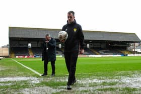 Referee Don Robertson calls the Dundee v Rangers match off during a secondary pitch inspection at Dens Park. (Photo by Ewan Bootman / SNS Group)