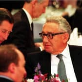 The-then Prince of Wales, now King Charles III, talks with former American secretary of state Dr Henry Kissinger during the Britain In The World conference at the Royal Institute of International Affairs in London. Picture: PA