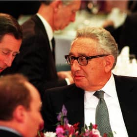The-then Prince of Wales, now King Charles III, talks with former American secretary of state Dr Henry Kissinger during the Britain In The World conference at the Royal Institute of International Affairs in London. Picture: PA