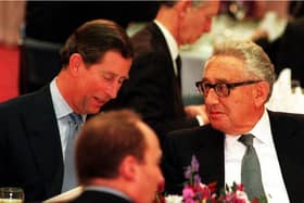 The-then Prince of Wales, now King Charles III, talks with former American secretary of state Dr Henry Kissinger during the Britain In The World conference at the Royal Institute of International Affairs in London. Picture: PA