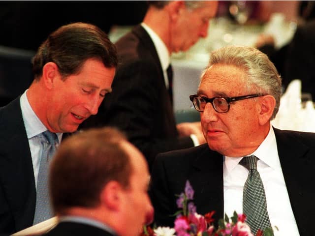 The-then Prince of Wales, now King Charles III, talks with former American secretary of state Dr Henry Kissinger during the Britain In The World conference at the Royal Institute of International Affairs in London. Picture: PA