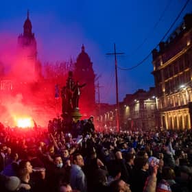 Rangers fans in George Square celebrating their team's title win on Sunday. Picture: SNS
