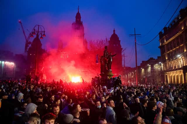 Rangers fans in George Square celebrating their team's title win on Sunday. Picture: SNS