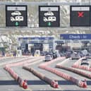 Cars queue at the check-in at the Port of Dover in Kent. Authorities have worked "around the clock" to clear both freight and tourist traffic in Dover, the port said. Some 72,000 passengers - more than 200 miles of tourist and freight traffic combined - had been processed by Sunday morning. Picture date: Sunday July 24, 2022.