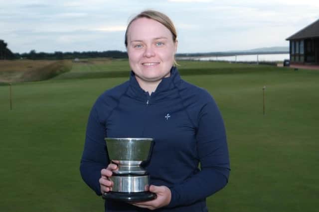 Carrine Taylor shows off the trophy after landing her eighth win in the Nairn ladies' club championship. Picture: Nairn Golf Club