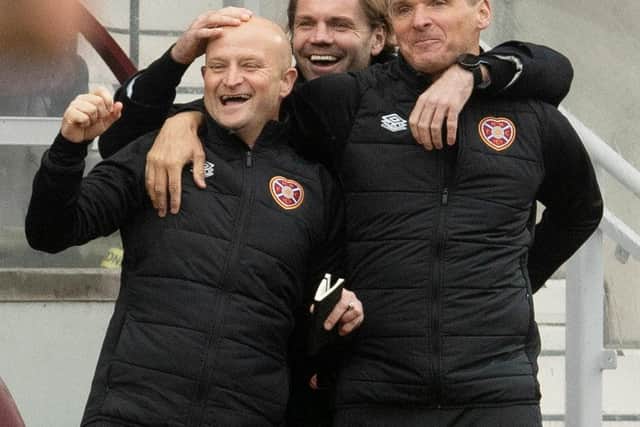 Hearts manager Robbie Neilson (centre) and assistant Grant Forrest (left) celebrate their second goal with assistant Lee McCulloch  during the victory over Motherwell. Photo by Craig Foy / SNS Group