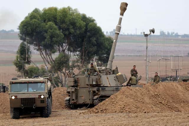 Israeli army artillary are positioned towards Gaza near the border with the Palestinian territory in southern Israel on Monday. Israel continued to battle Hamas fighters on October 9 and massed tens of thousands of troops and heavy armour around the Gaza Strip after vowing a massive blow over the Palestinian militants' surprise attack.