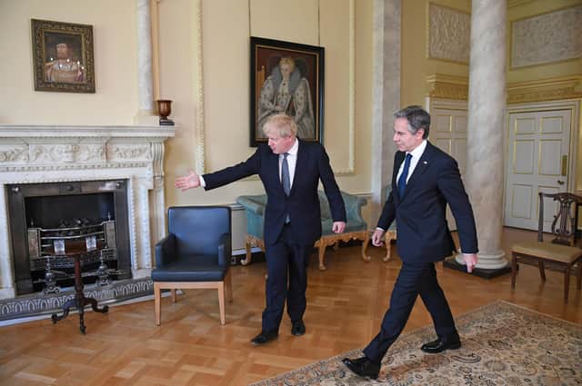 Boris Johnson ushers US Secretary of State Antony Blinken to his seat inside 10 Downing Street. A trade deal with the US is foreign policy imperative for Brexit Britain (Picture: Stefan Rousseau/PA)