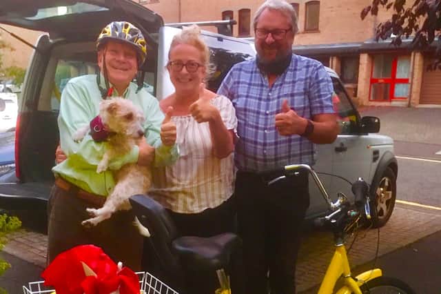 Joe Goldblatt, left, is reunited with his yellow tricycle (Picture courtesy of Joe Goldblatt)